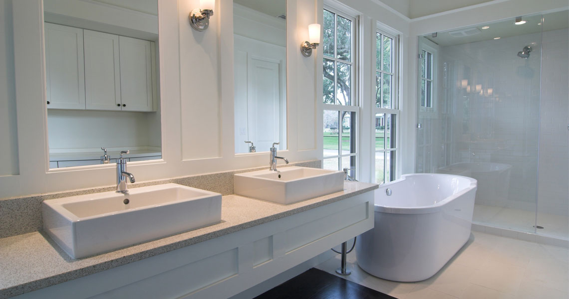 White modern bathroom design with double vessel sink bathroom vanity, bath tub and a shower