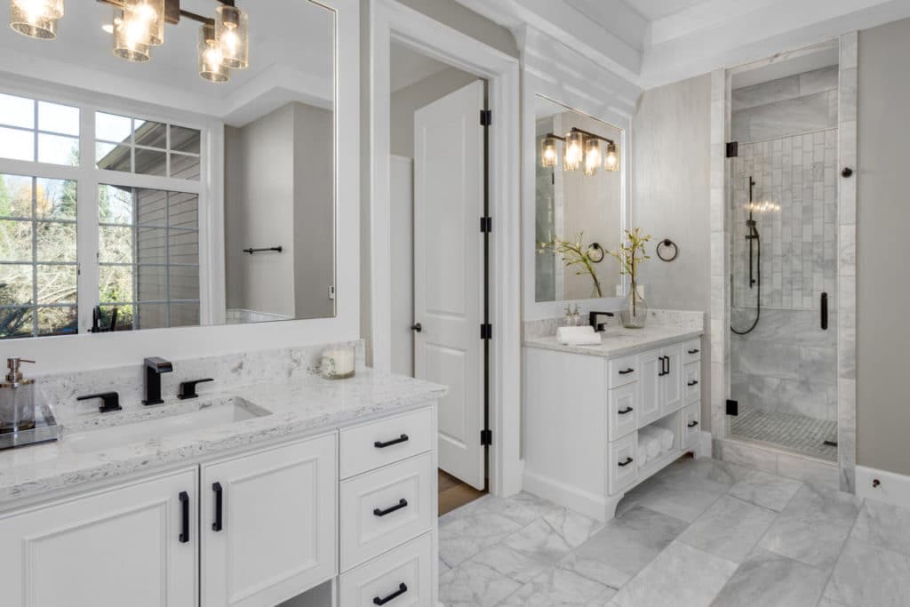 white bathroom design with two single sink bathroom vanities