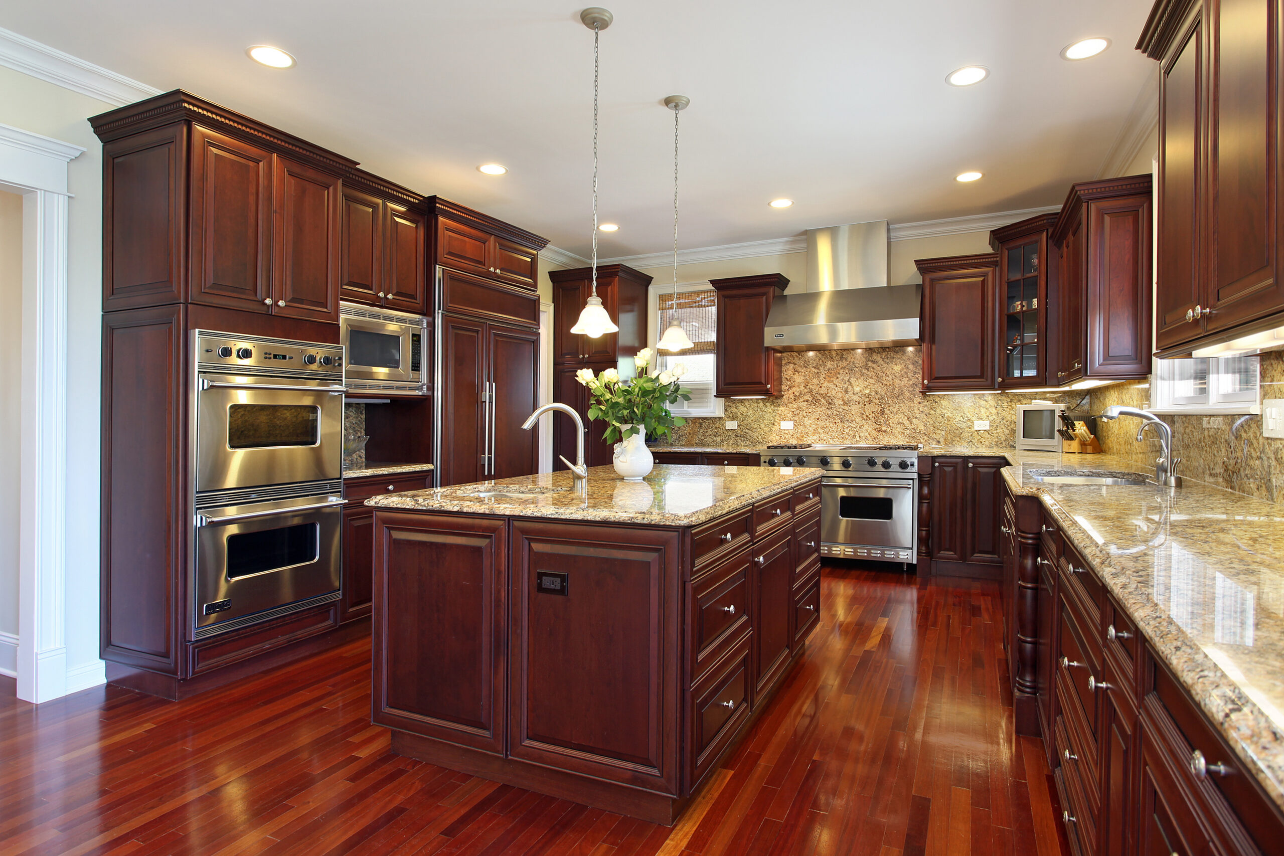 Kitchen in luxury home with cherry wood cabinetry