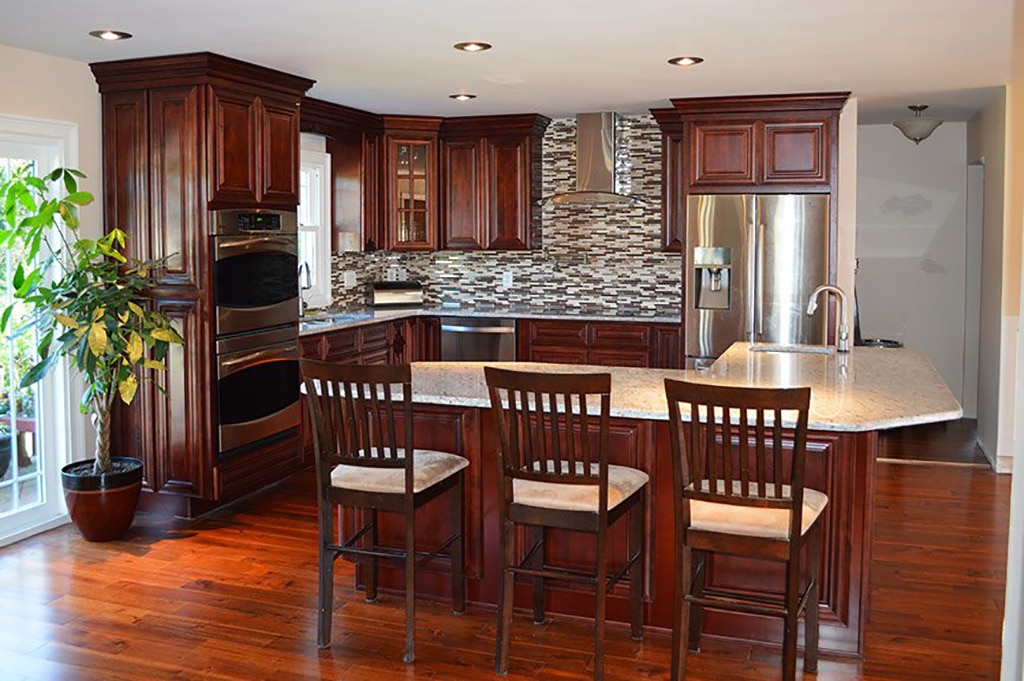 21st Century dark brown kitchen cabinets with whitecountertops