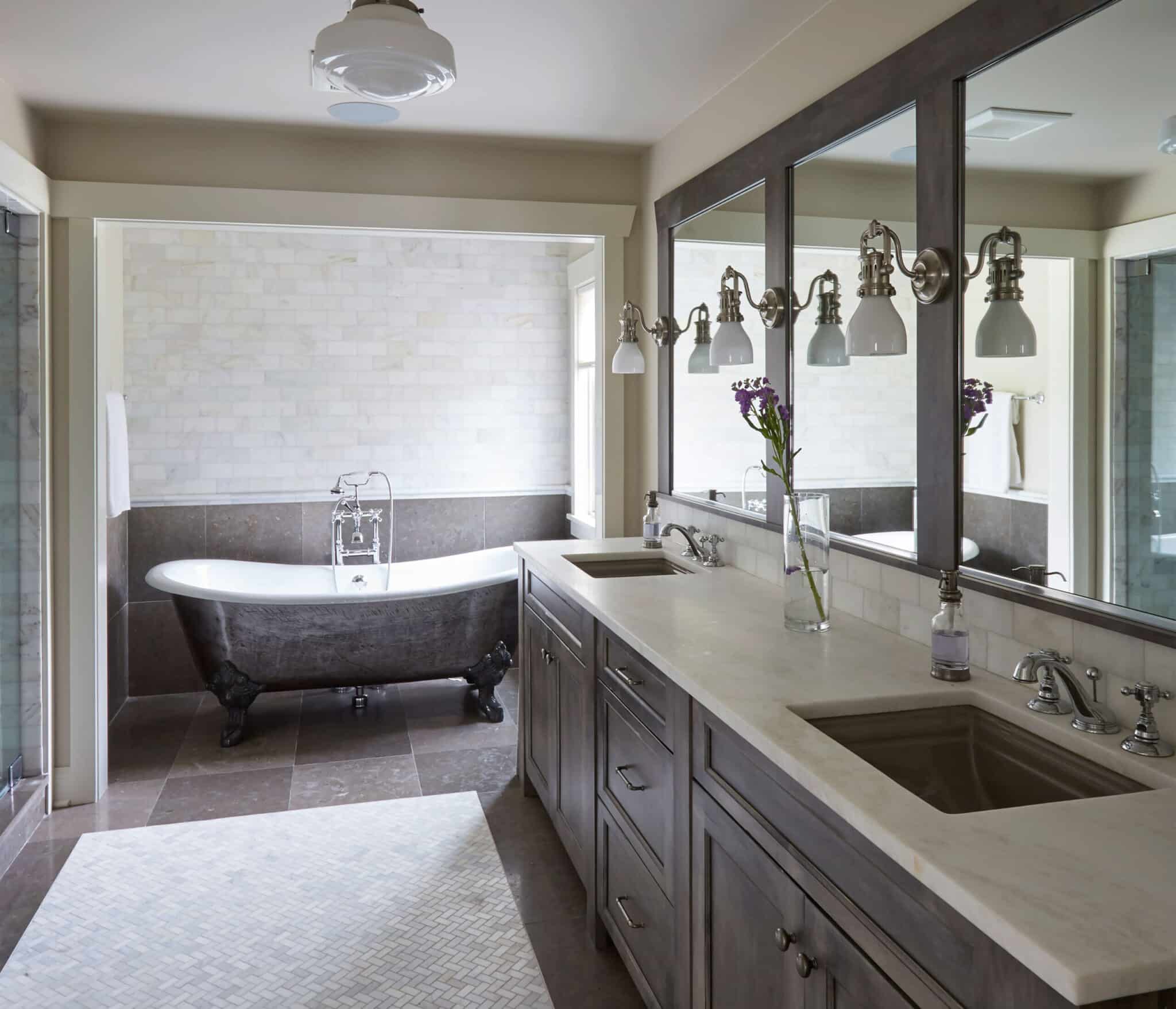 Traditional bathroom style with dark grey bathroom cabinet and white countertop