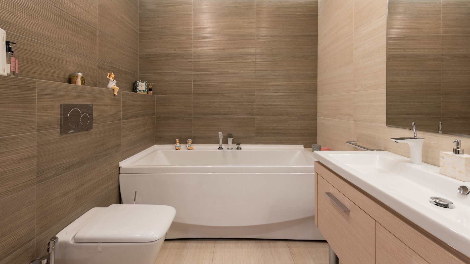 Modern bathroom with brown wall-mounted cabinets, toilet and bath tub