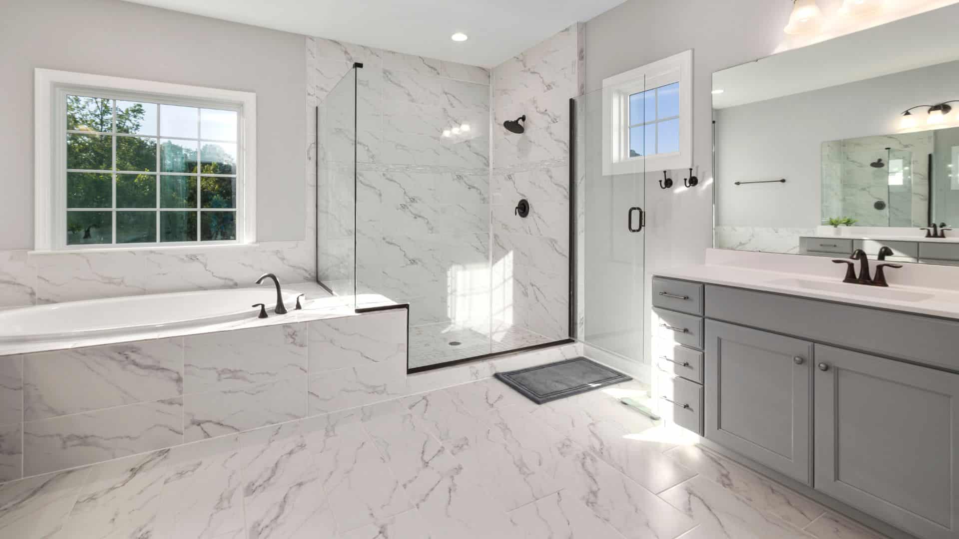 Luxury white bathroom with grey bathroom cabinet and white countertop