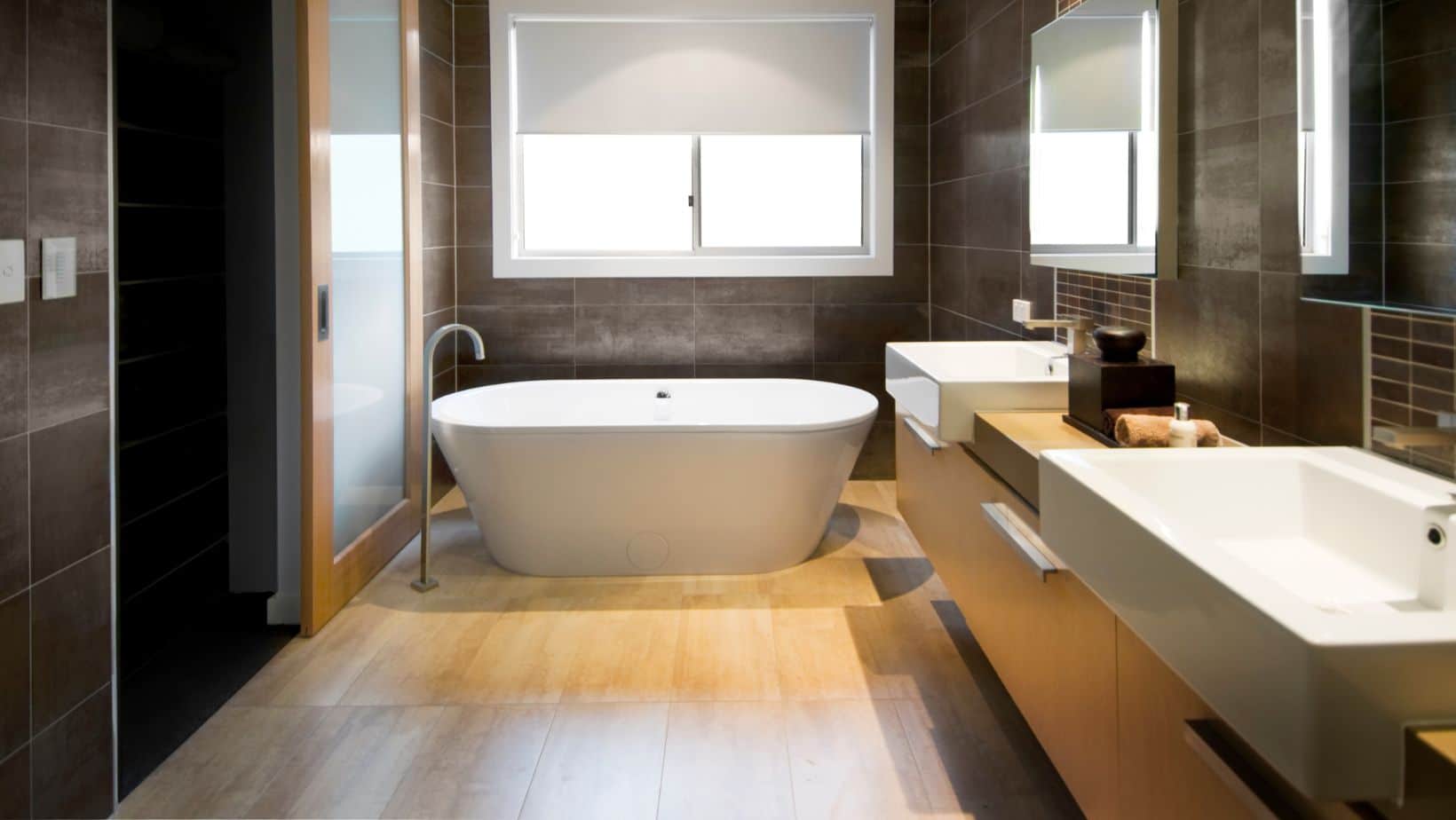 Modern bathroom style with brown contemporary double-sink cabinets, bath tub, and shower