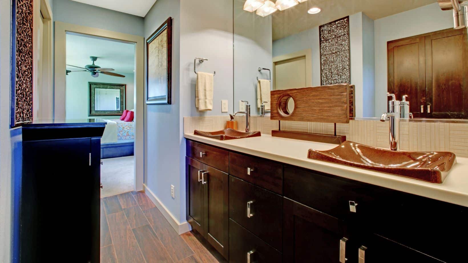 Traditional style bathroom with dark brown double-sink cabinets