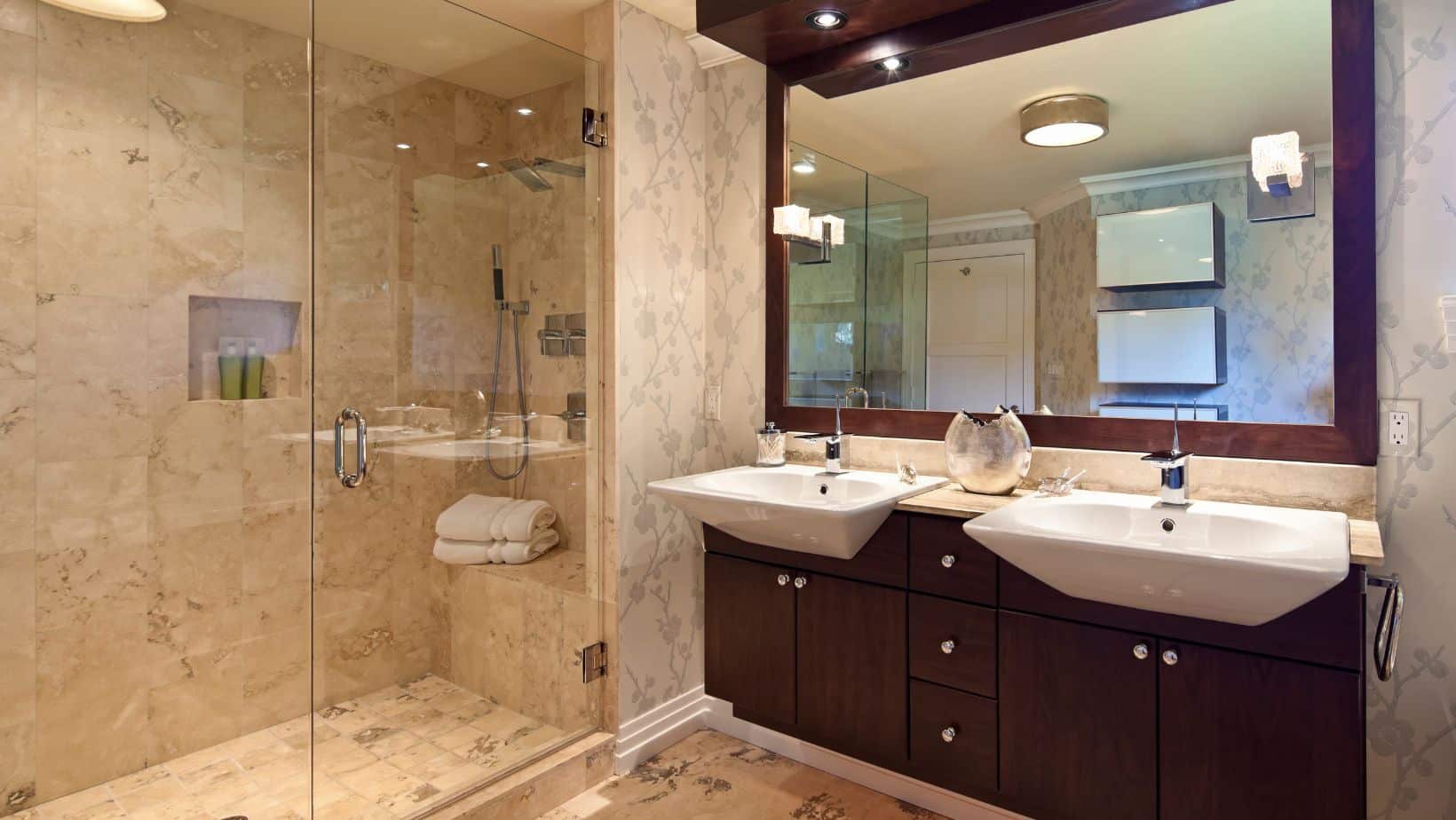 Elegant bathroom with dark brown cabinets, and a shower