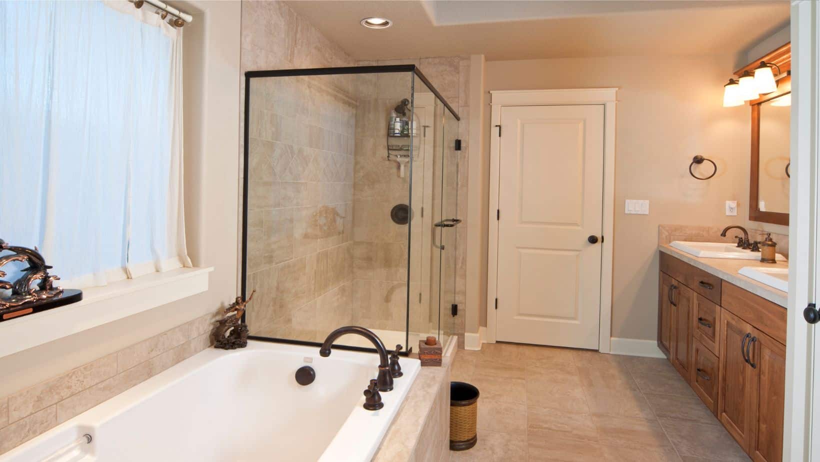 Elegant bathroom with brown cabinet, shower and bath tub