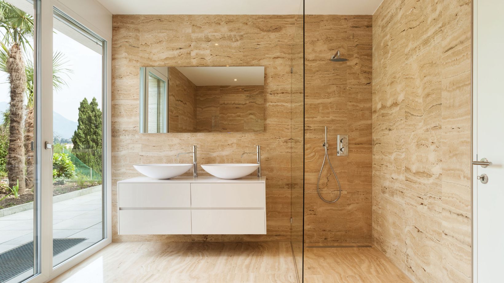 Modern bathroom style with floating cream vessel sink bathroom cabinets and a walk-in shower