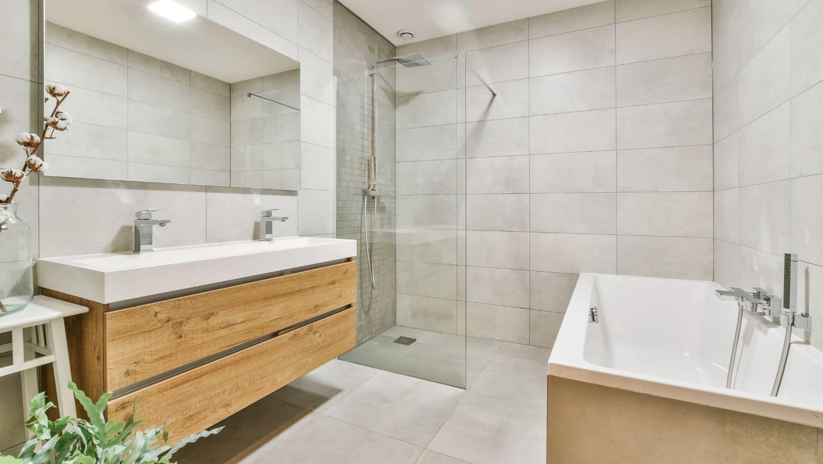 Light relaxing bathroom with wood floating cabinets, walk-in shower and a bath tub