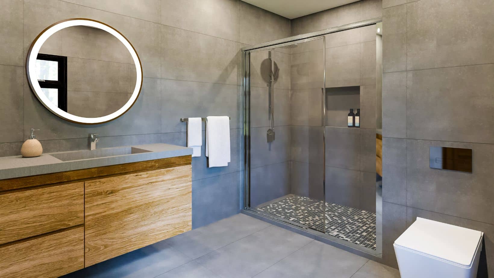 Grey modern bathroom with wood floating bathroom cabinets, grey countertop, toilet, and walk-in shower