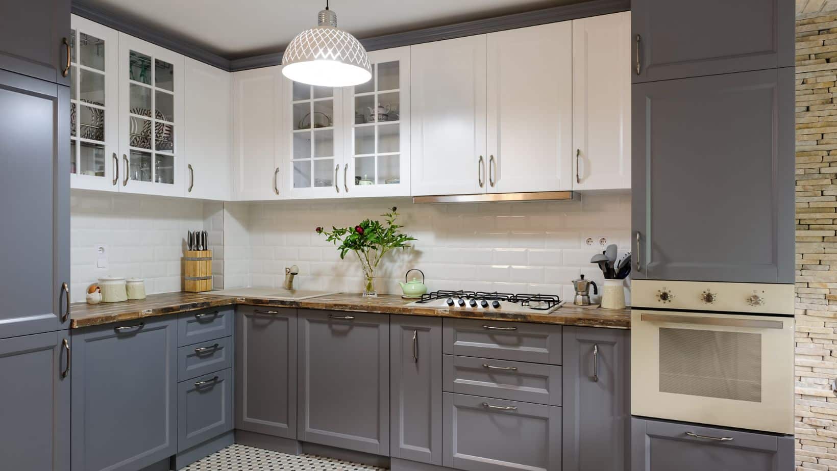Dark Grey kitchen cabinets with brown countertops
