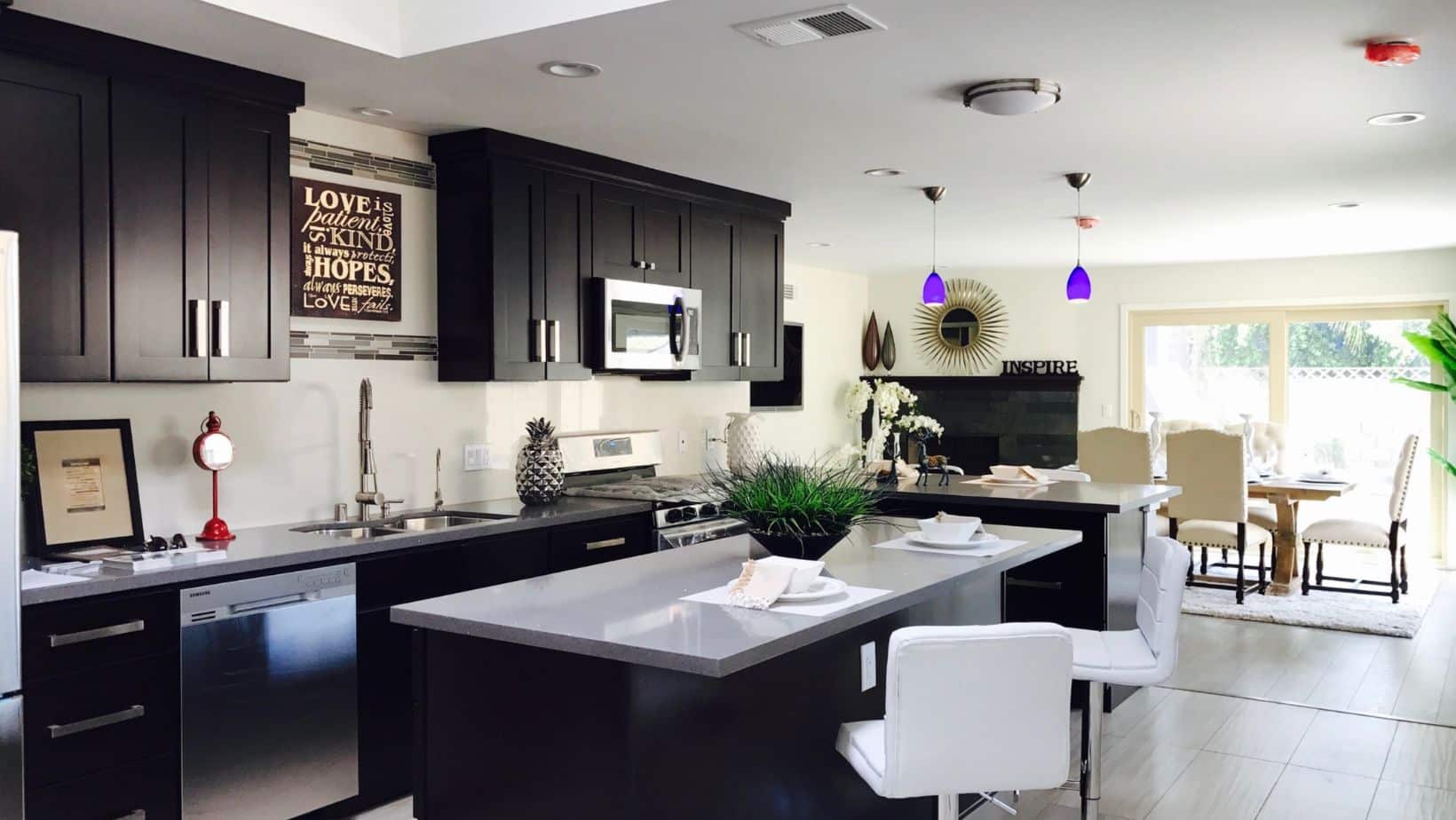 Black kitchen cabinets with white countertops
