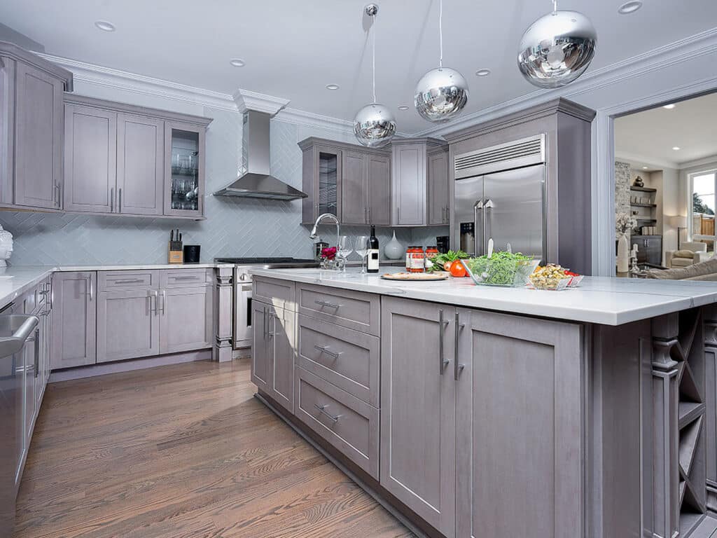 Gray shaker kitchen cabinet with white countertop