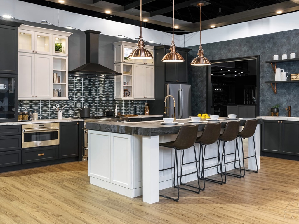 J&K black kitchen cabinets with white countertop and white kitchen island with grey top