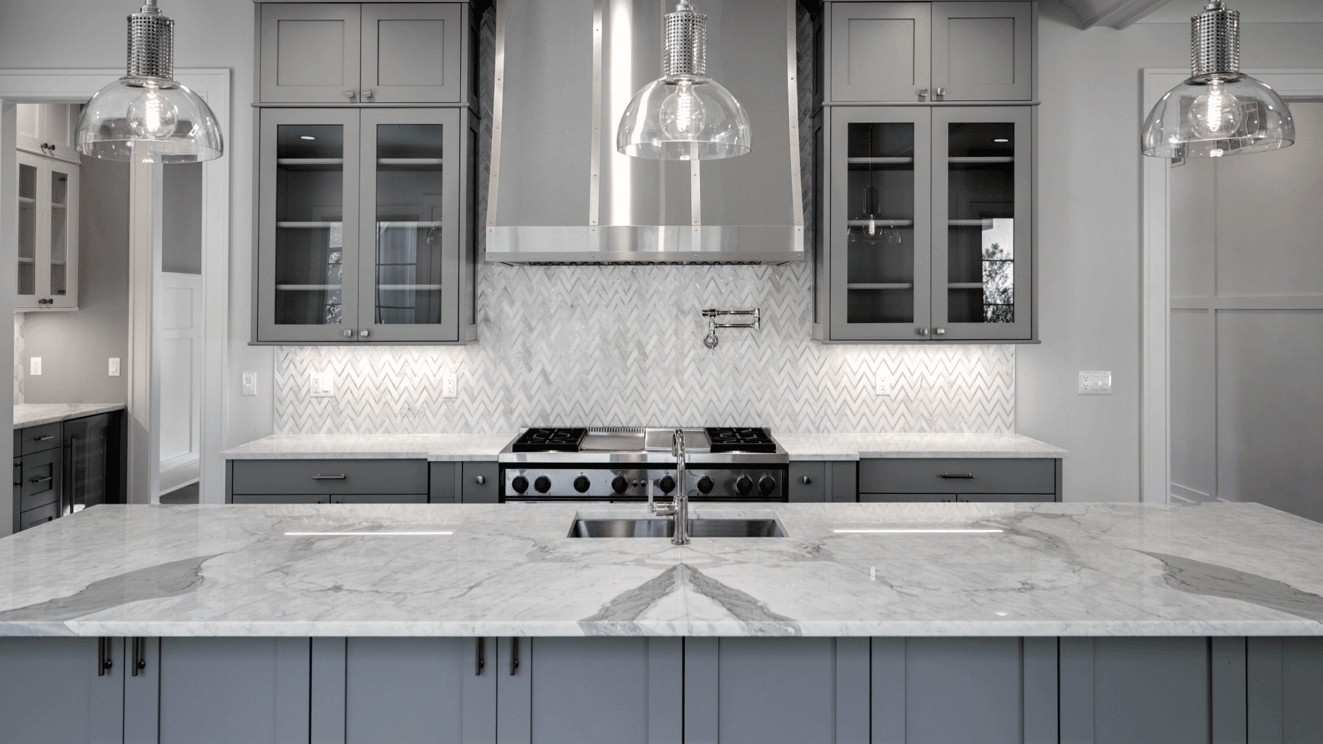 St. Martin Light grey kitchen cabinet with white countertop