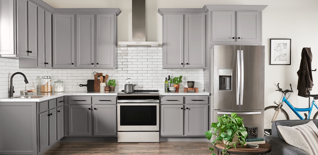 Wolf Kitchen Light Grey kitchen cabinets in white countertop