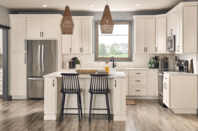 Wolf cream kitchen cabinets with white countertops