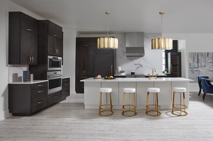 Wolf dark brown kitchen cabinets with white countertop and white kitchen island