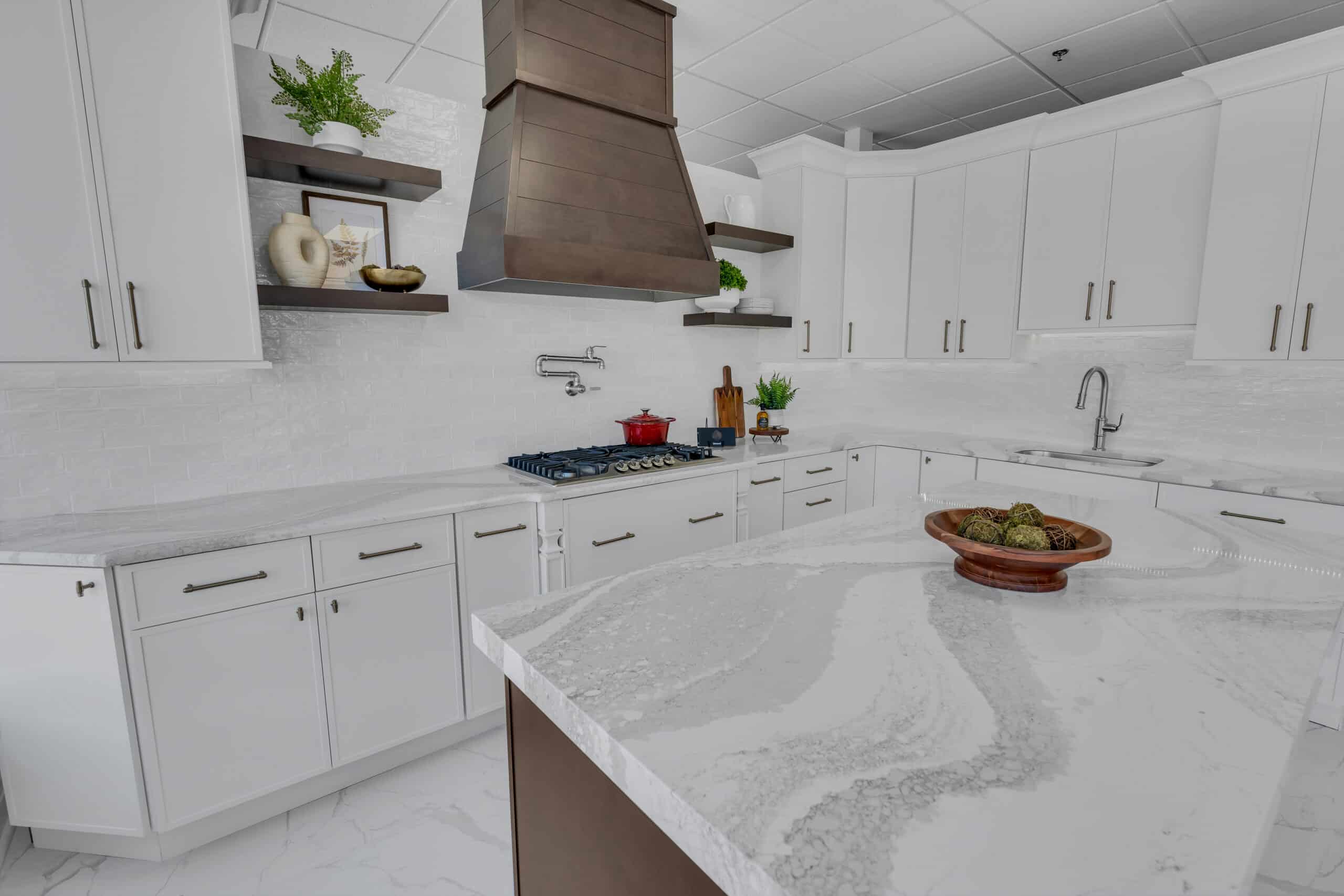 White kitchen design with elegant white quartz countertop