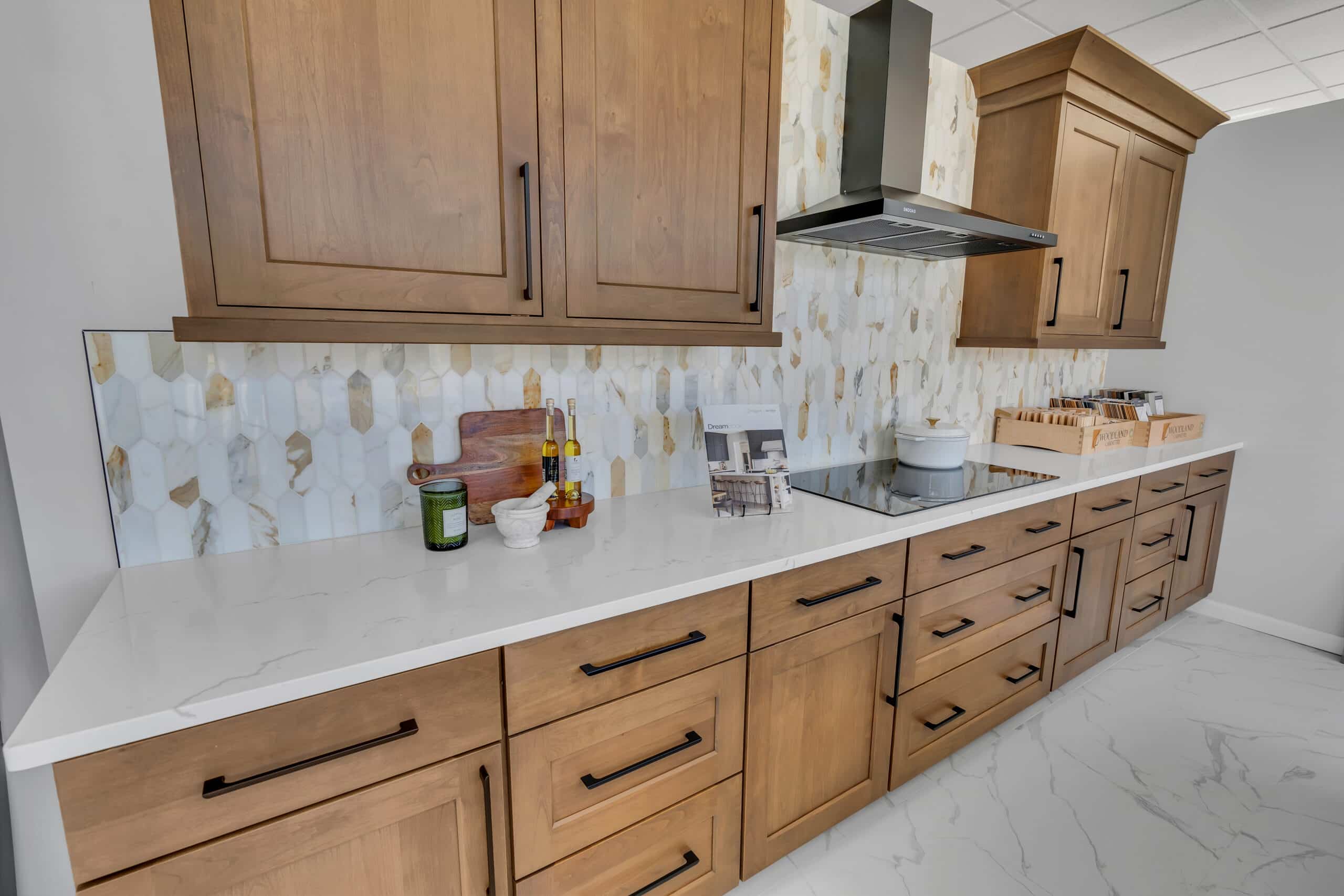 Brown kitchen cabinet with white countertop kitchen design