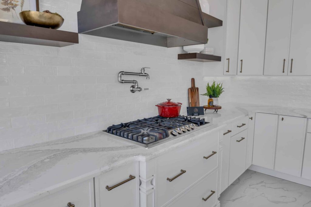 White kitchen cabinets with white quartz countertop