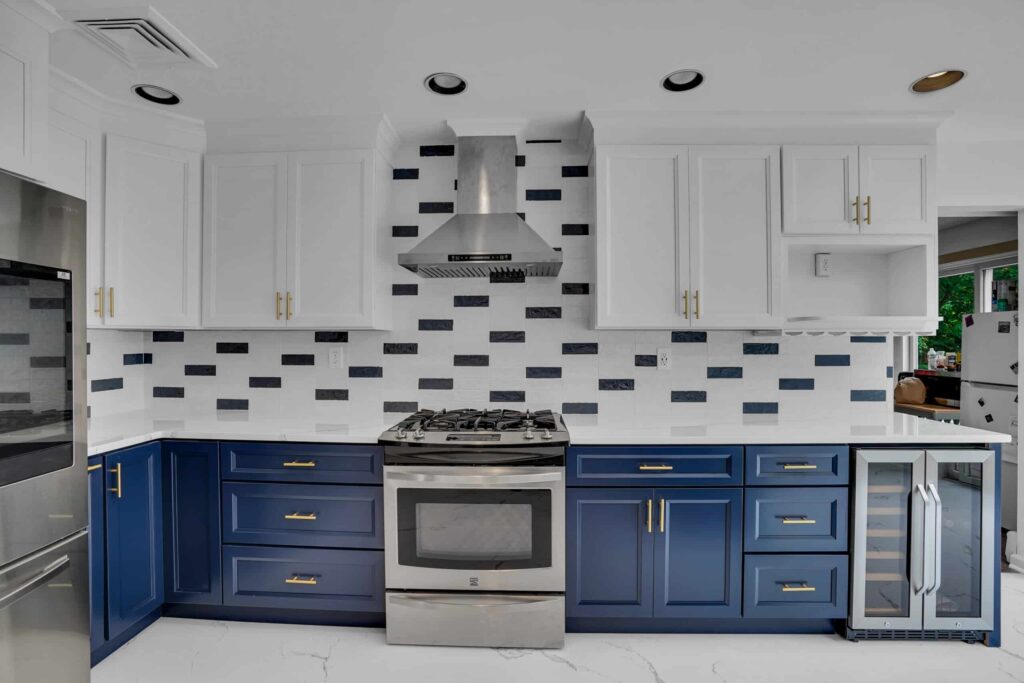 White and Blue Kitchen design with shaker cabinets and elegant backsplash