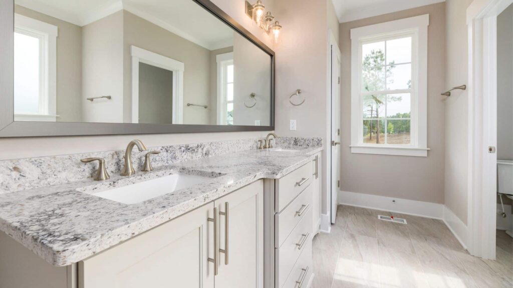 Bathroom showing double sink bathroom cabinets with elegant countertop