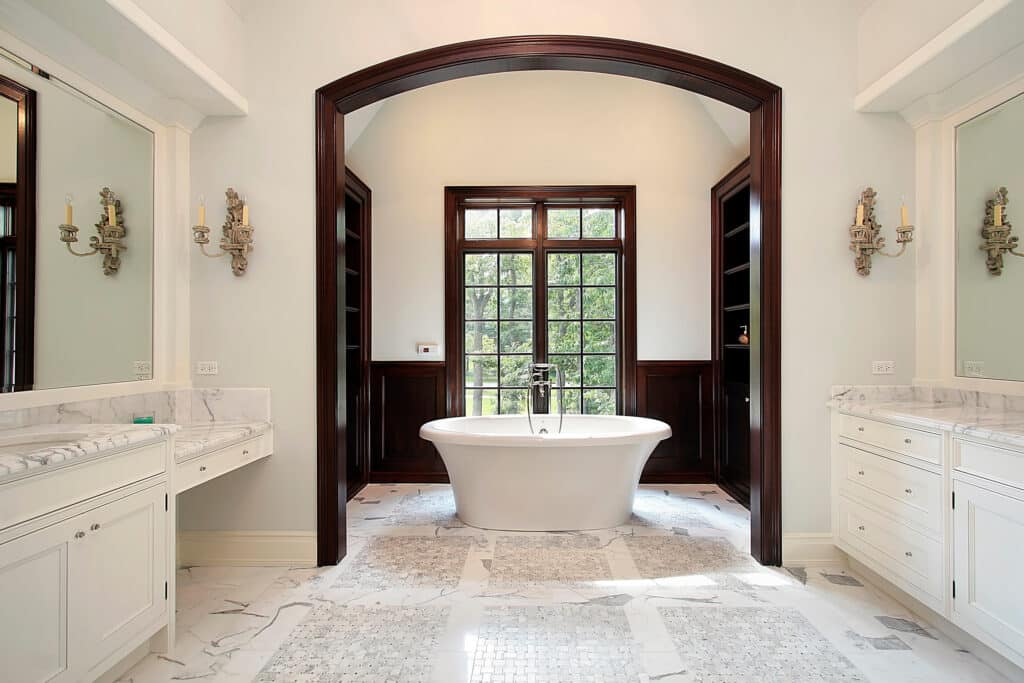 Master bath in luxury home with arched tub area