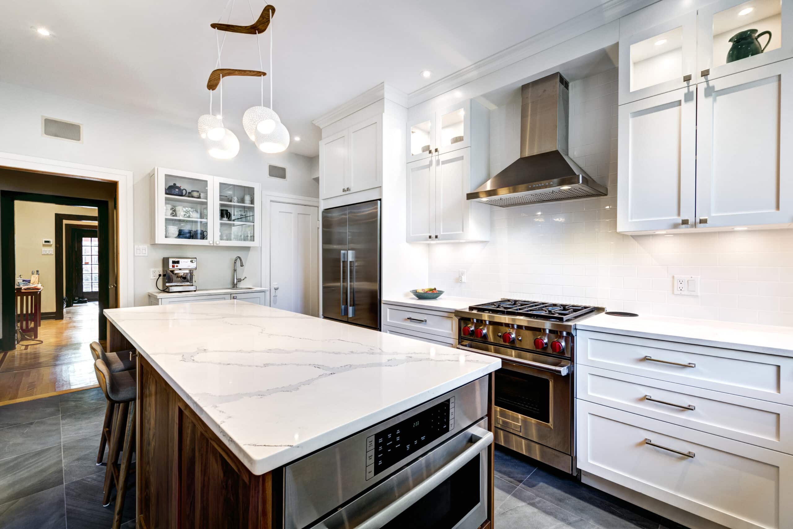 Luxury white kitchen with shaker cabinet and quartz countertop