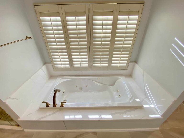 Bath tub beside window