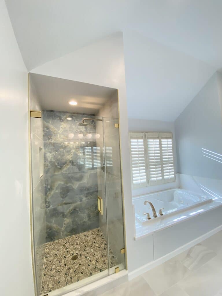 White bathroom design with shower and bathtub