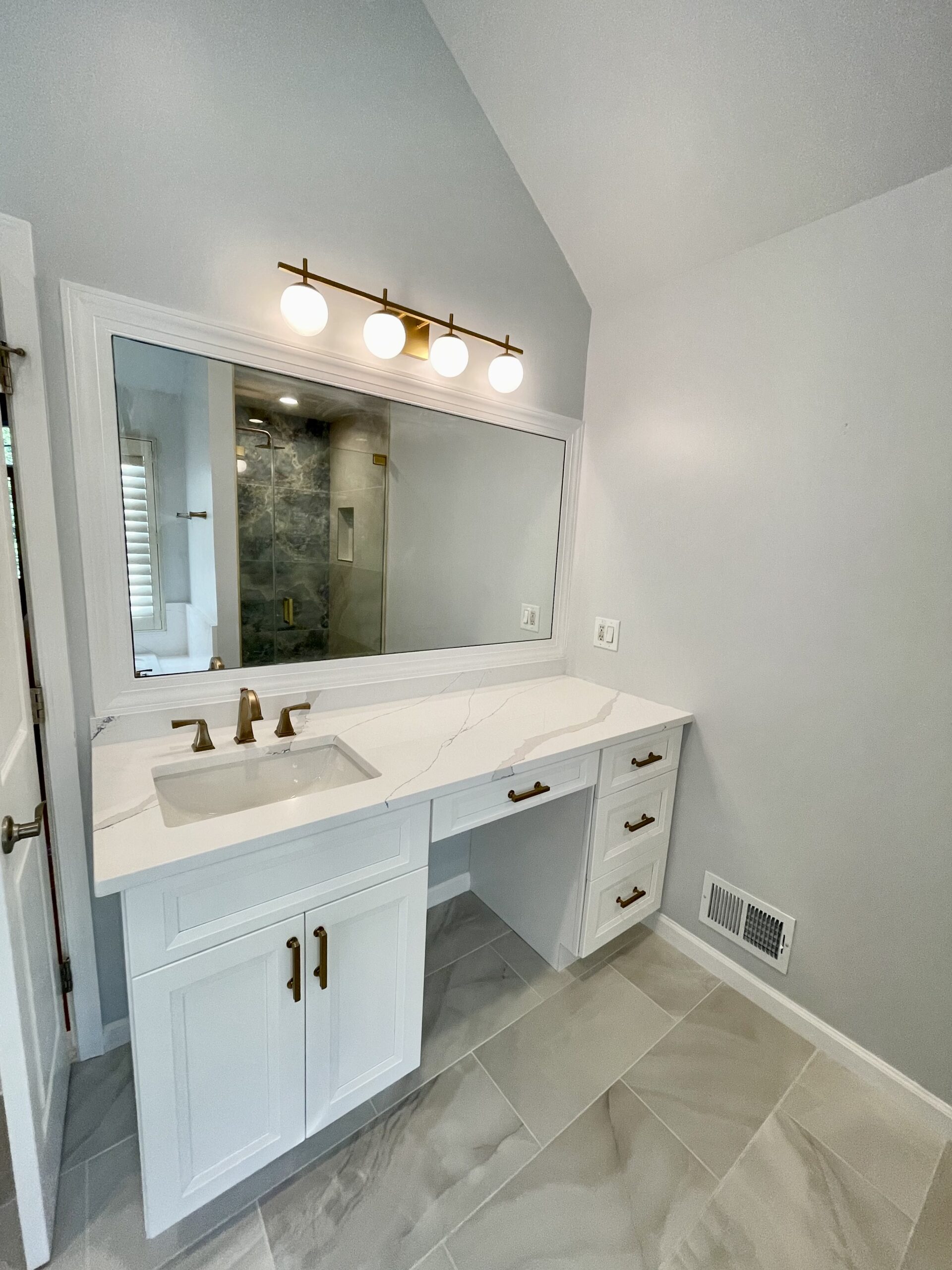 white single sink vanities in modern bathroom with gray flooring tiles