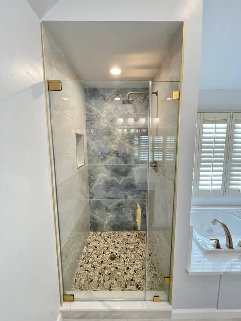 bathroom shower room with shower glass, tile surround and flooring