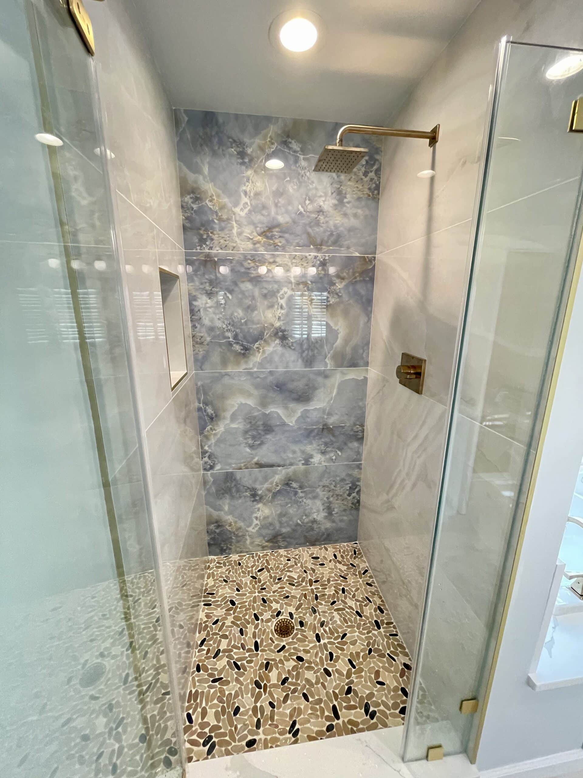 bathroom shower room with shower glass, tile surround and flooring