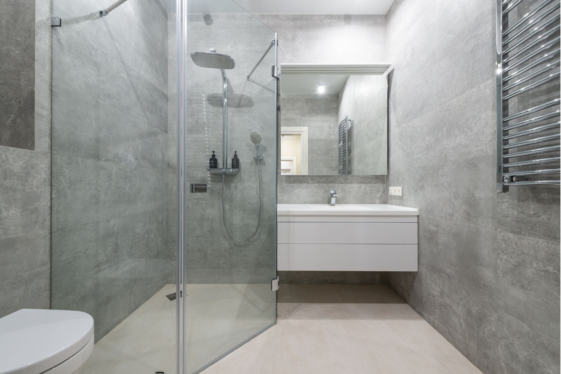 Small grey bathroom with neo-angle shower