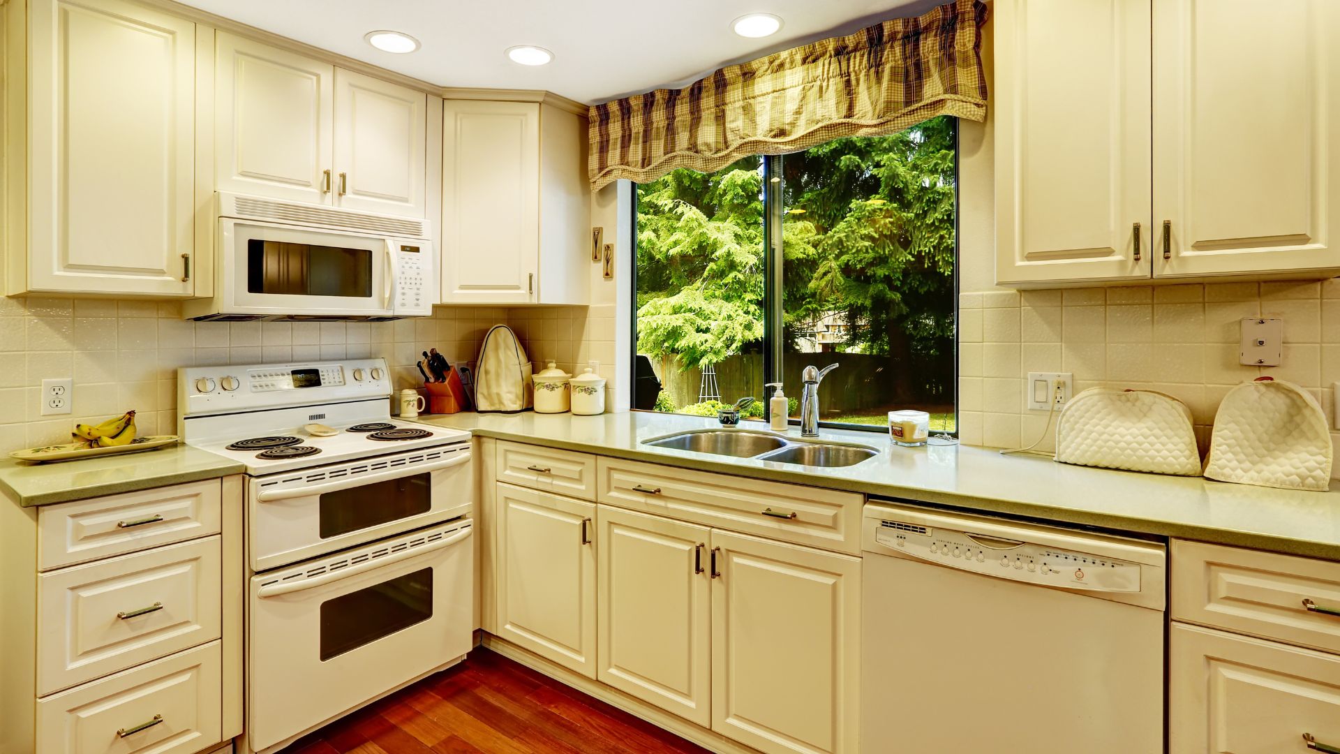 Old World Kitchen style in cream cabinets and countertop