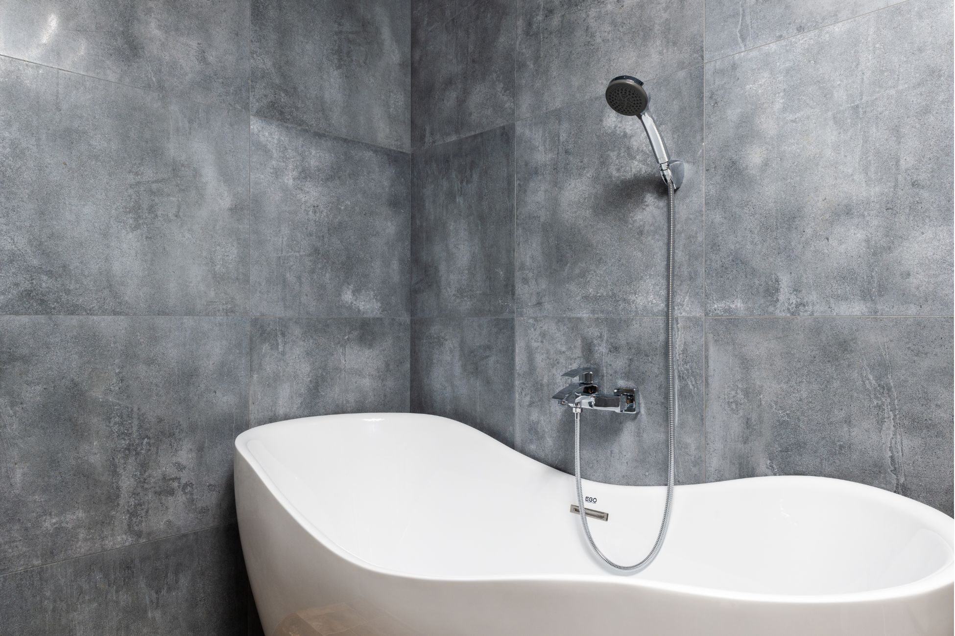 Grey bathroom with tub-shower combination