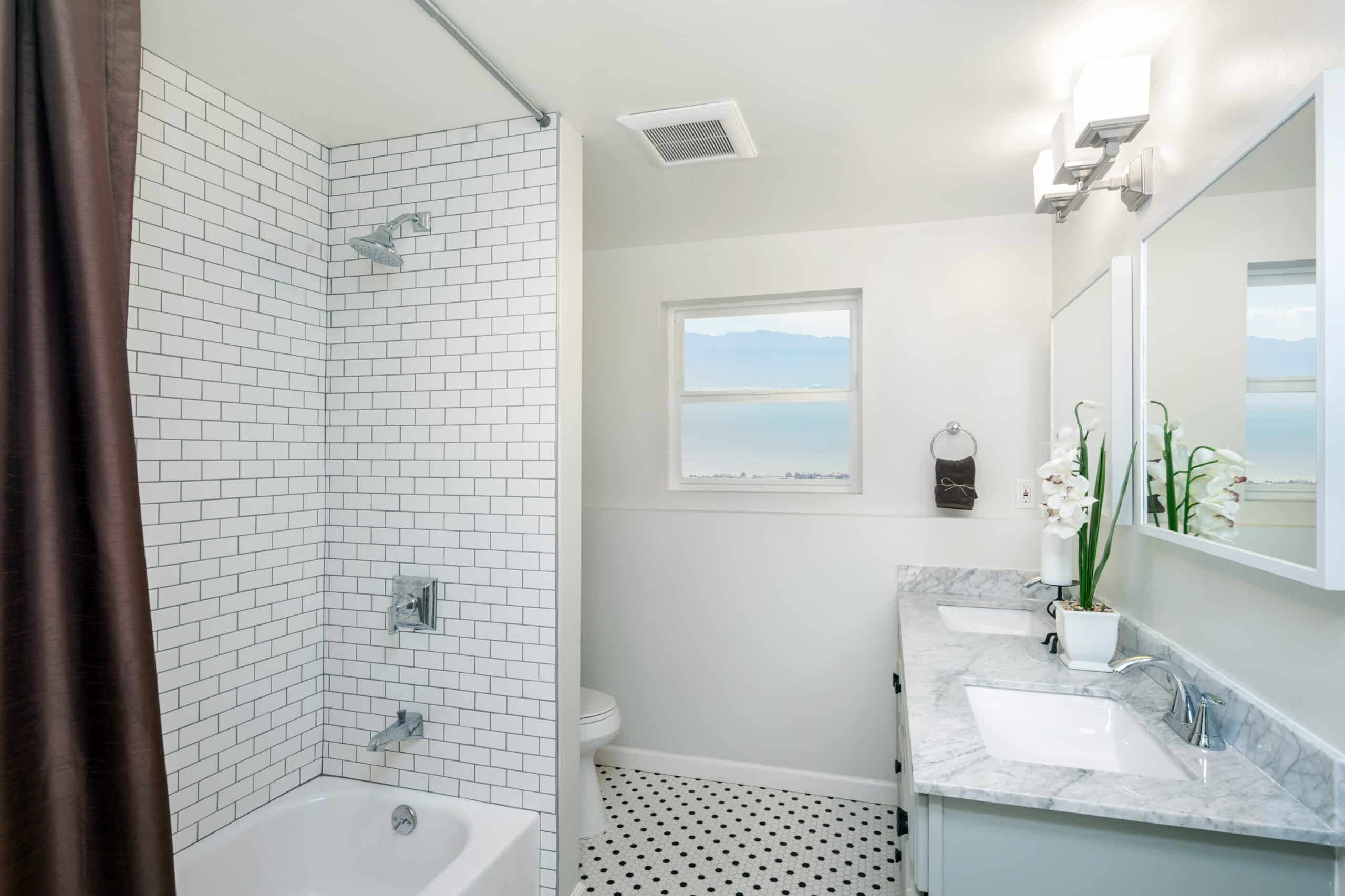 Small white bathroom with tub-shower combination