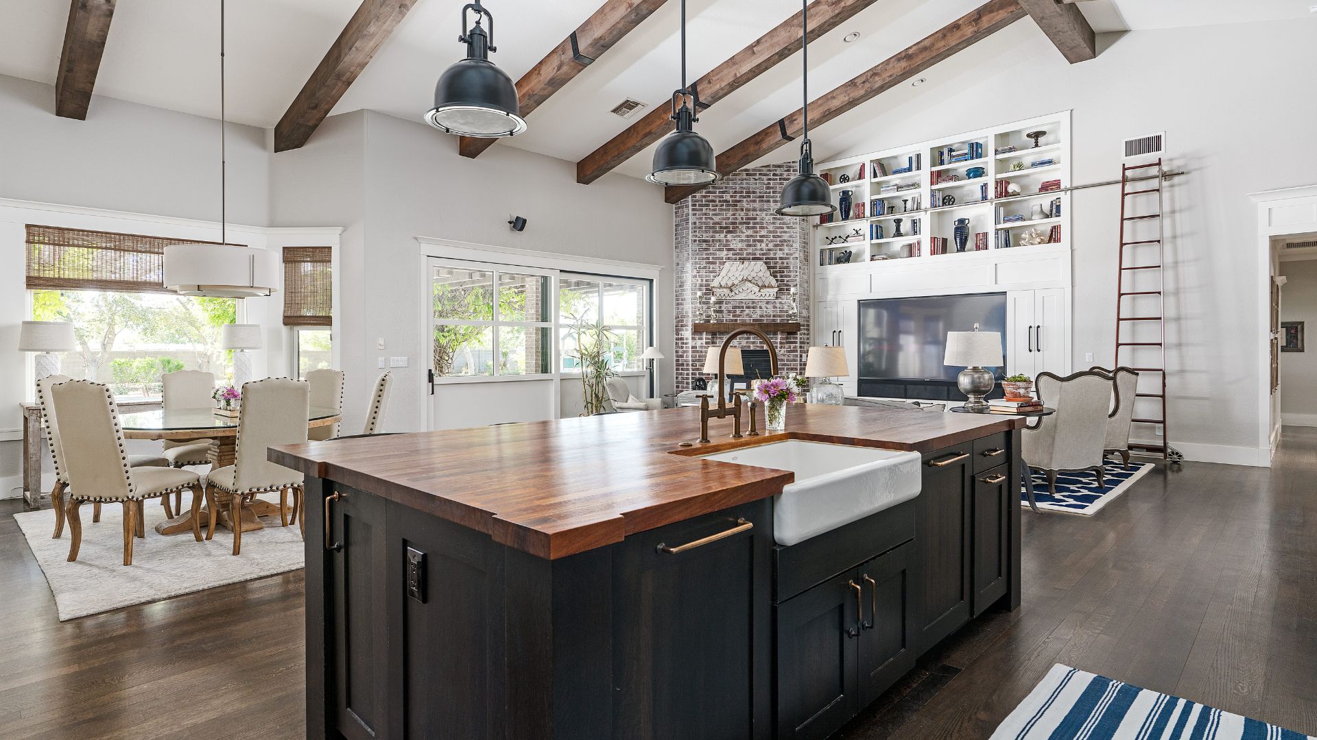 Boho kitchen style with brown wood countertop and gray island cabinet