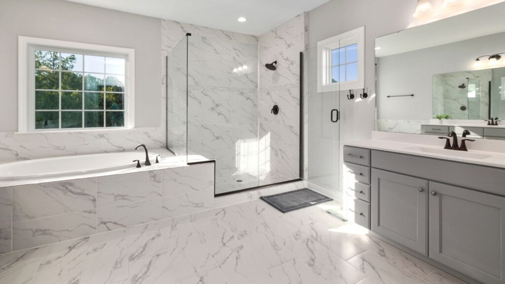 Luxury white bathroom style with grey transitional bathroom cabinets, walk in shower and bath tub