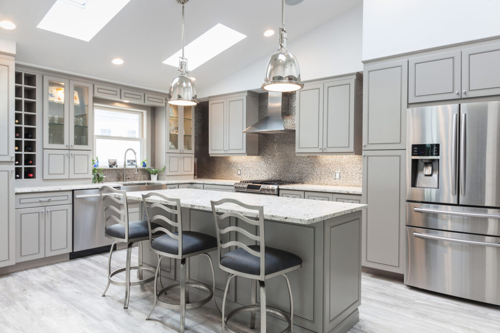 Elegant kitchen style with grey base and transitional wall cabinets