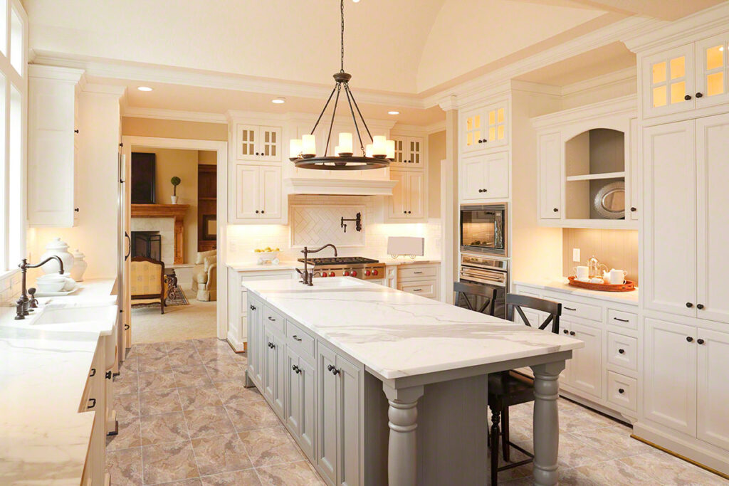 Luxury kitchen with travertine tile flooring
