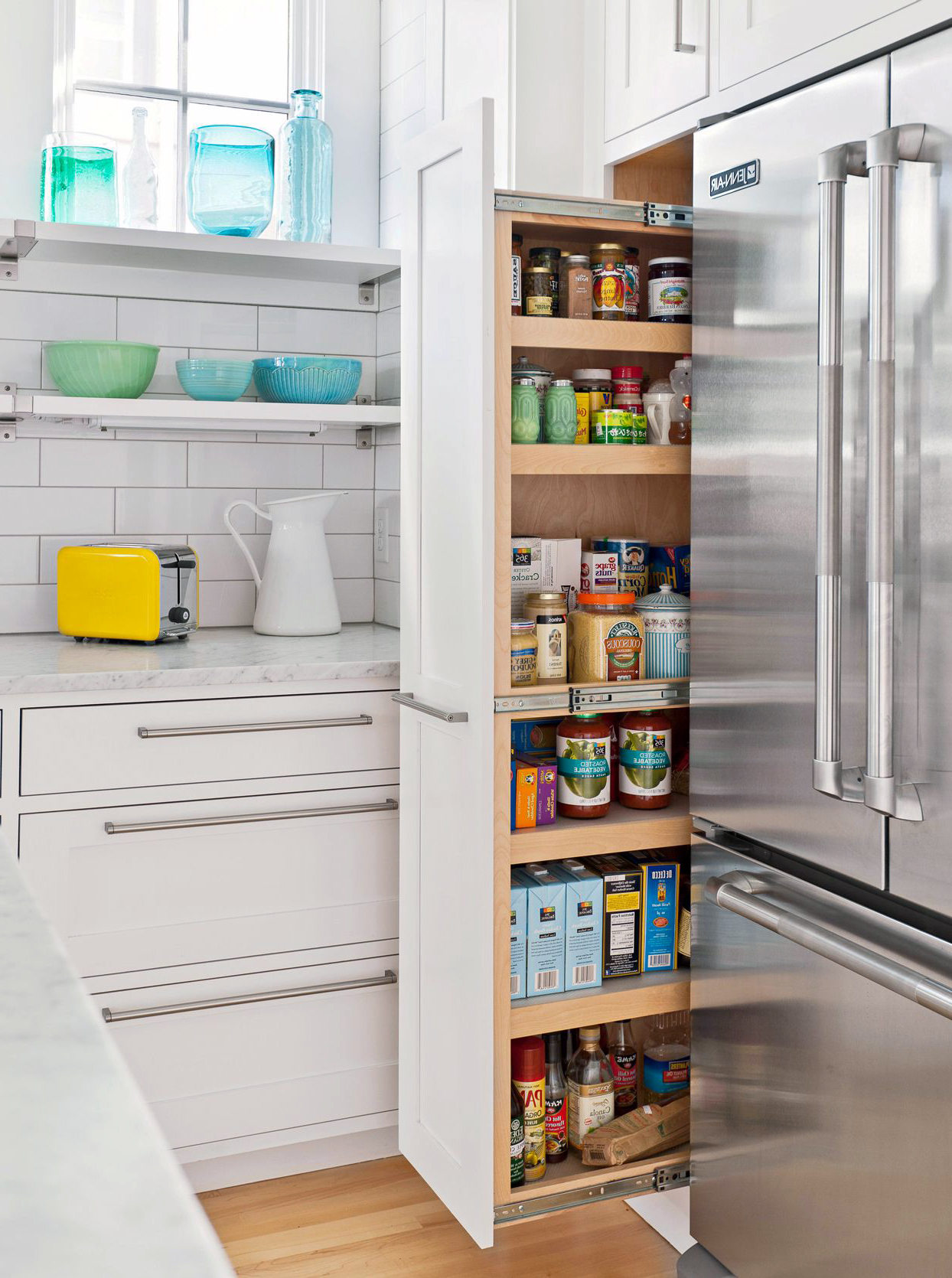 White Kitchen Cabinet featuring custom pantry cabinet beside a refrigerator