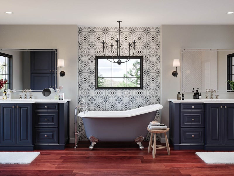 Traditional bathroom style with 2 navy blue vanities with bath tub in the middle