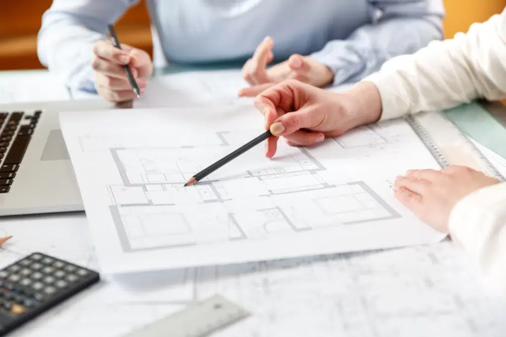 Designers drawing sketch plan for remodeling