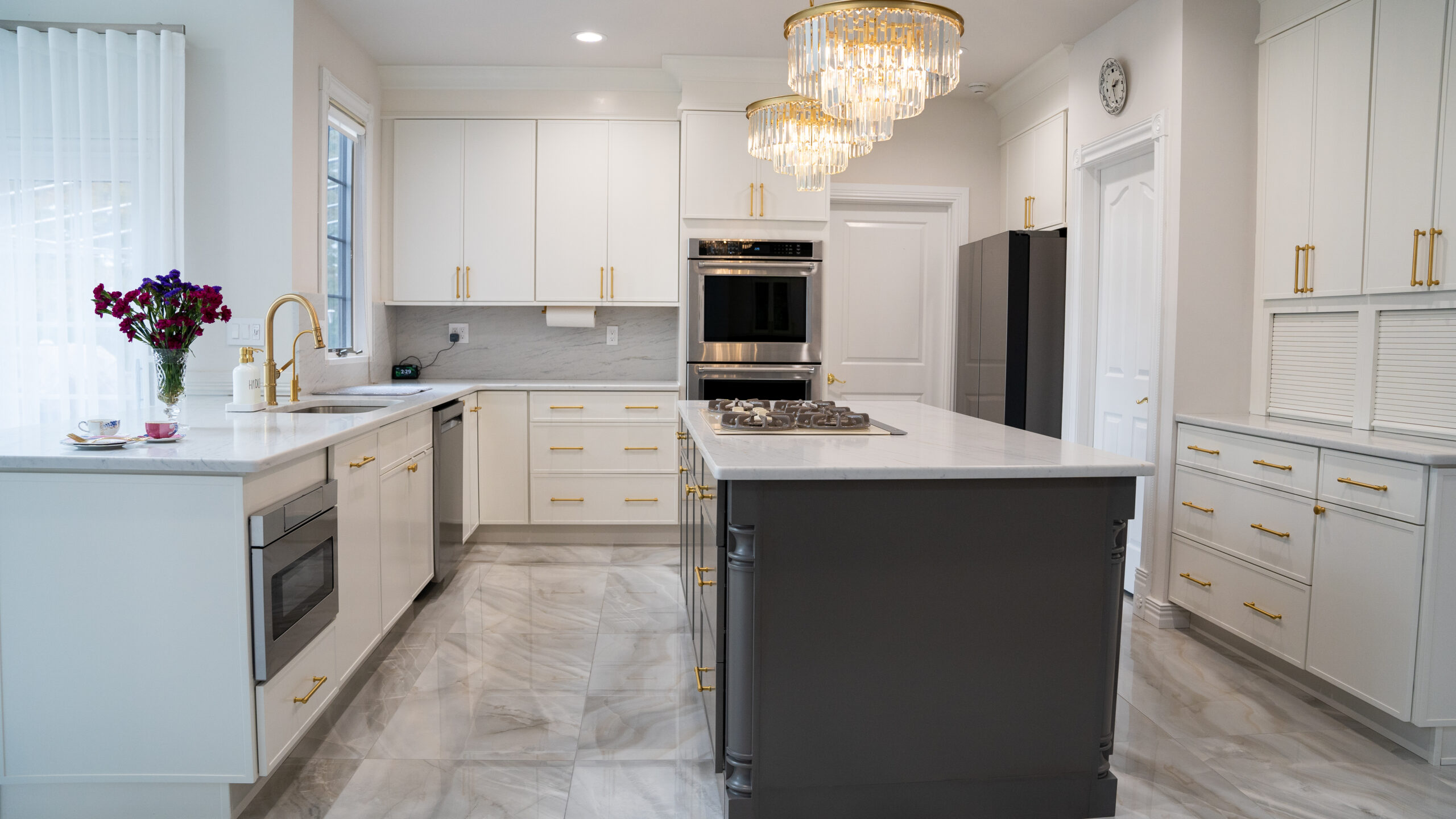 Luxury kitchen style with white cabinets and grey kitchen island