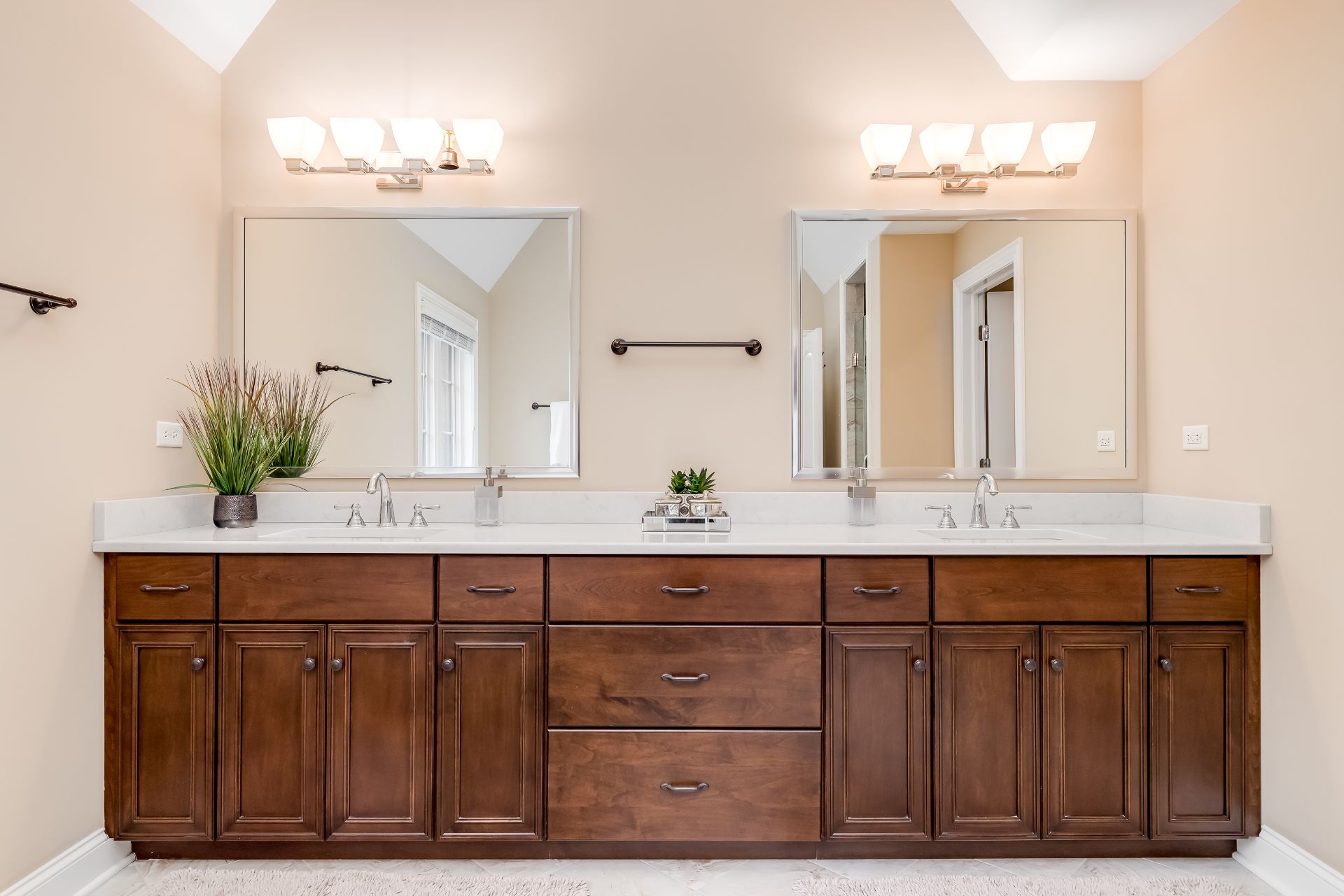 Cream bathroom with double-sink dark brown vanity