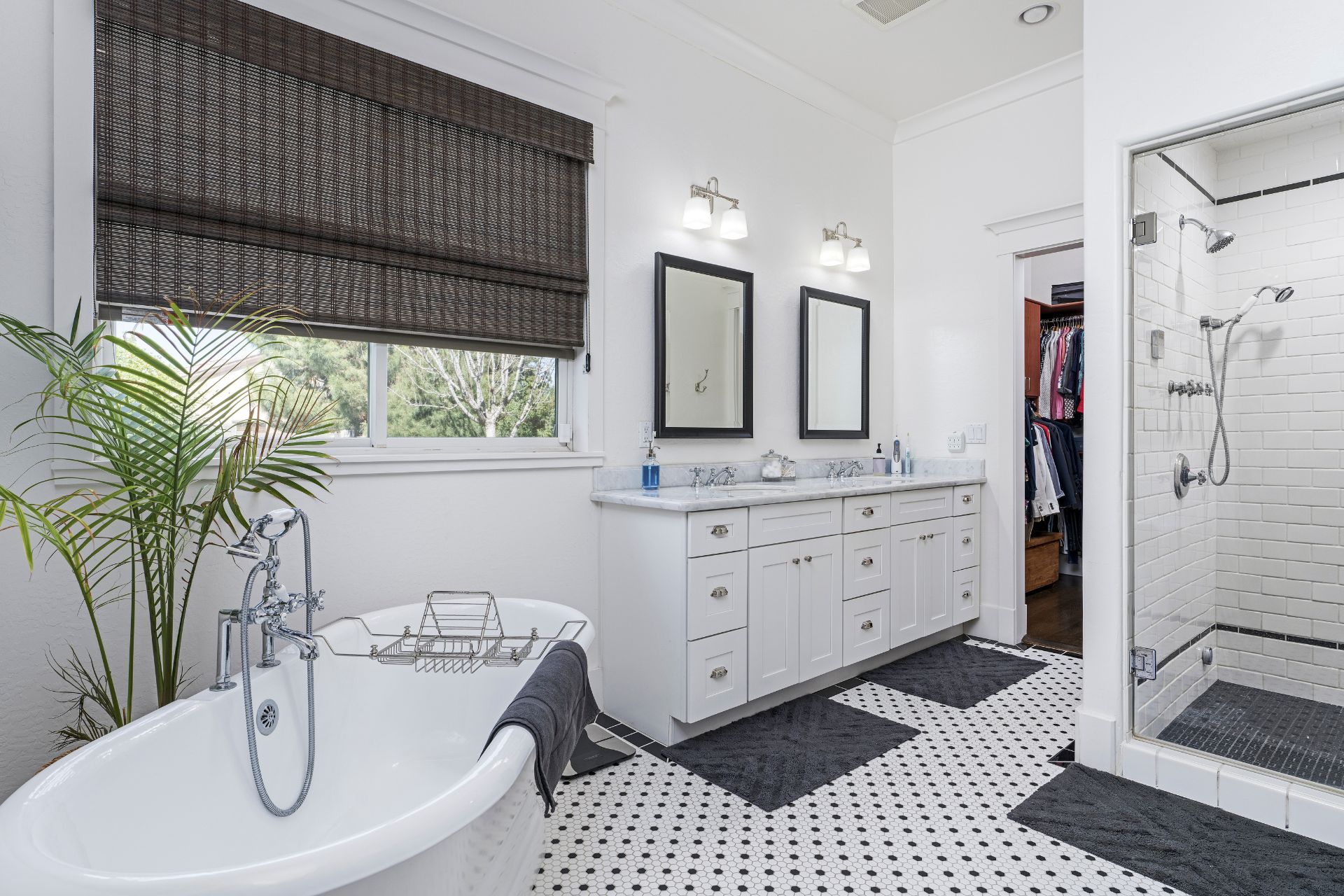 White bathroom with bath tub, shower and double-sink bathroom vanity