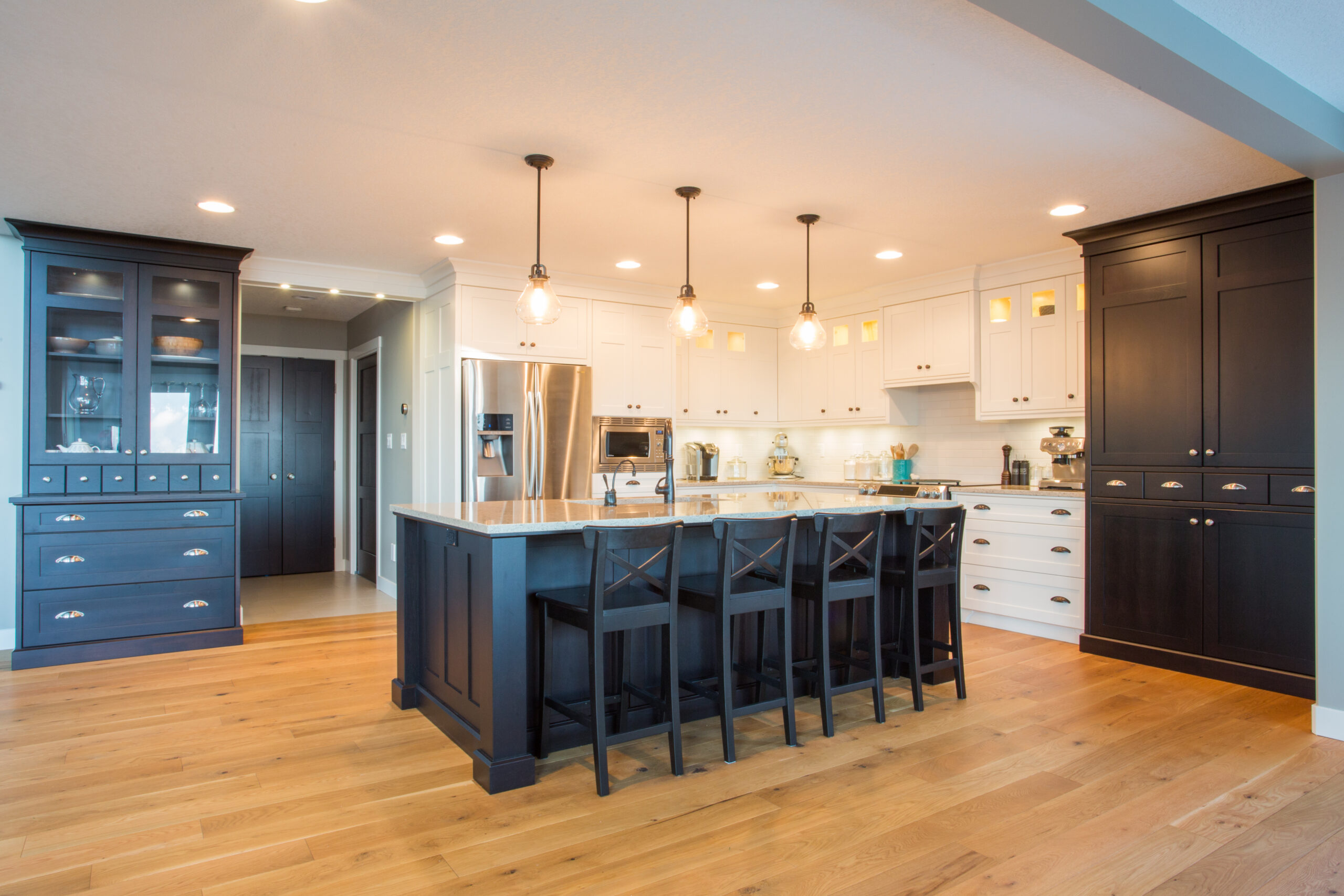 Elegant kitchen design with white, and dark brown cabinets