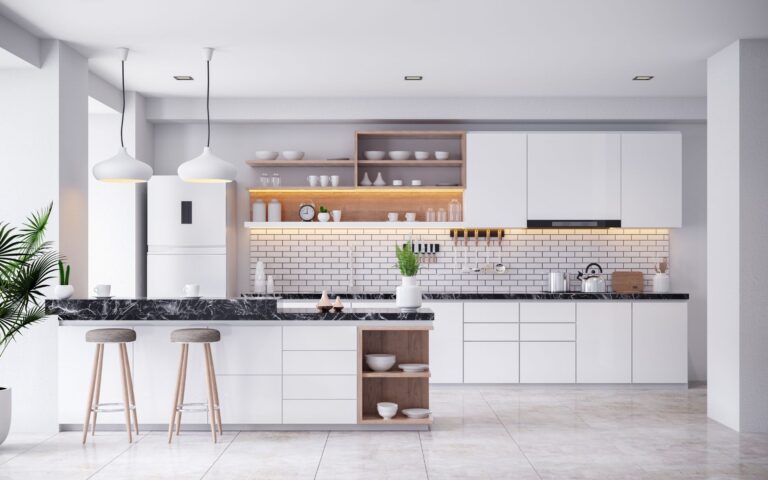 Elegant white kitchen cabinets with black countertop